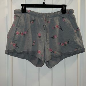 Grey and flower pattern shorts. No stains or holes